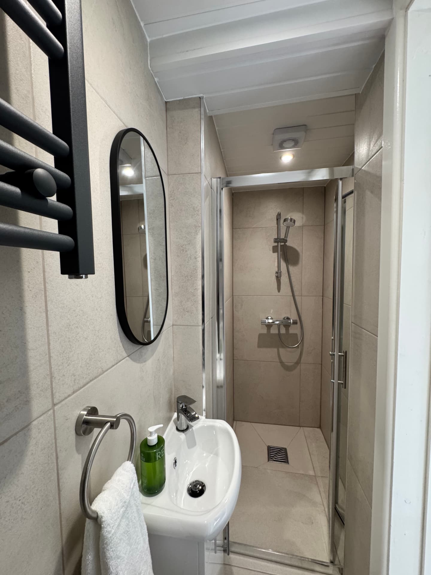 Walk in shower room with heated towel rail at the Wellingborough Luxury Staycation