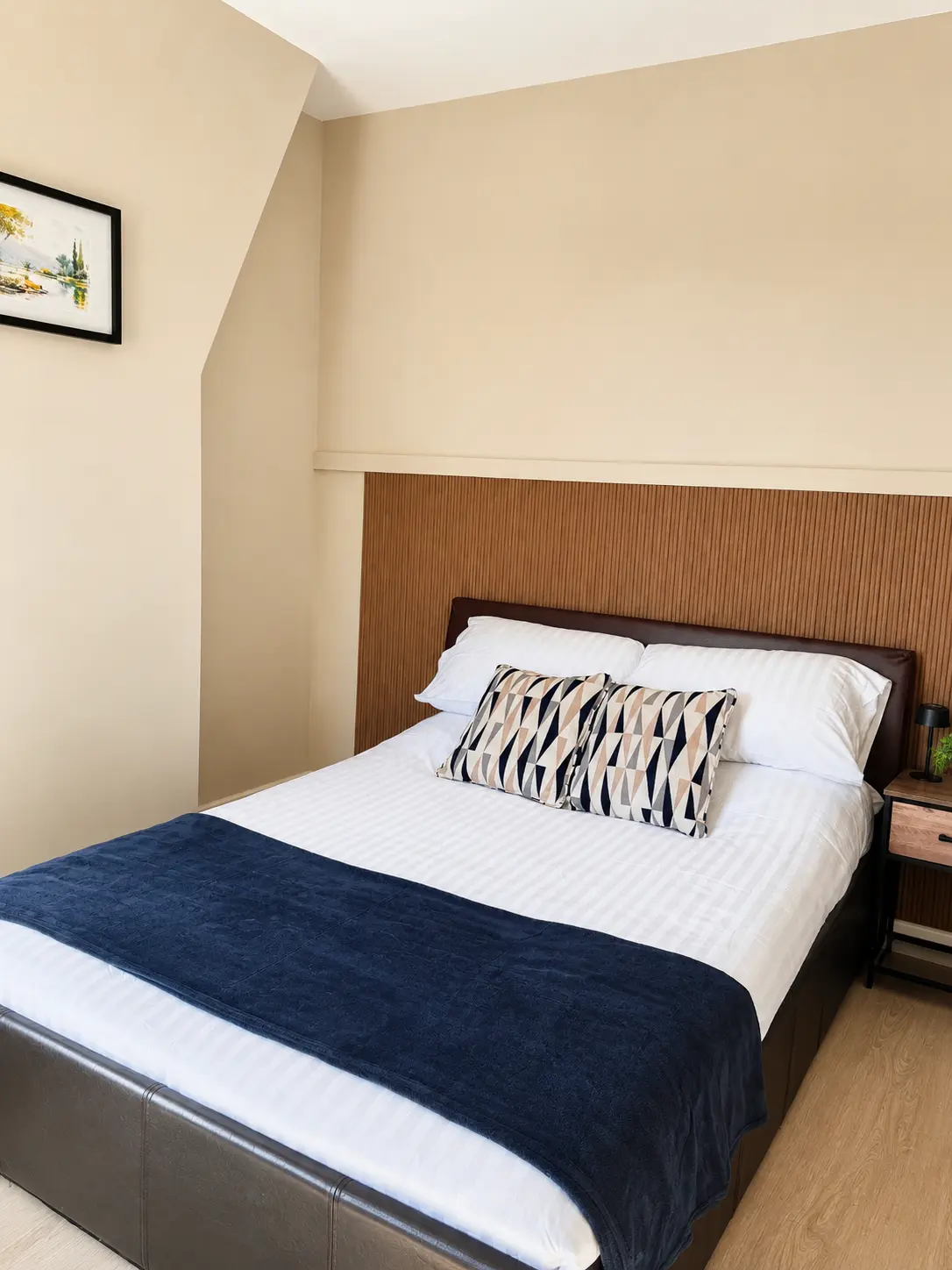 Second upstairs bedroom with double bed and panelled headboard at the Wellingborough Luxury Staycation