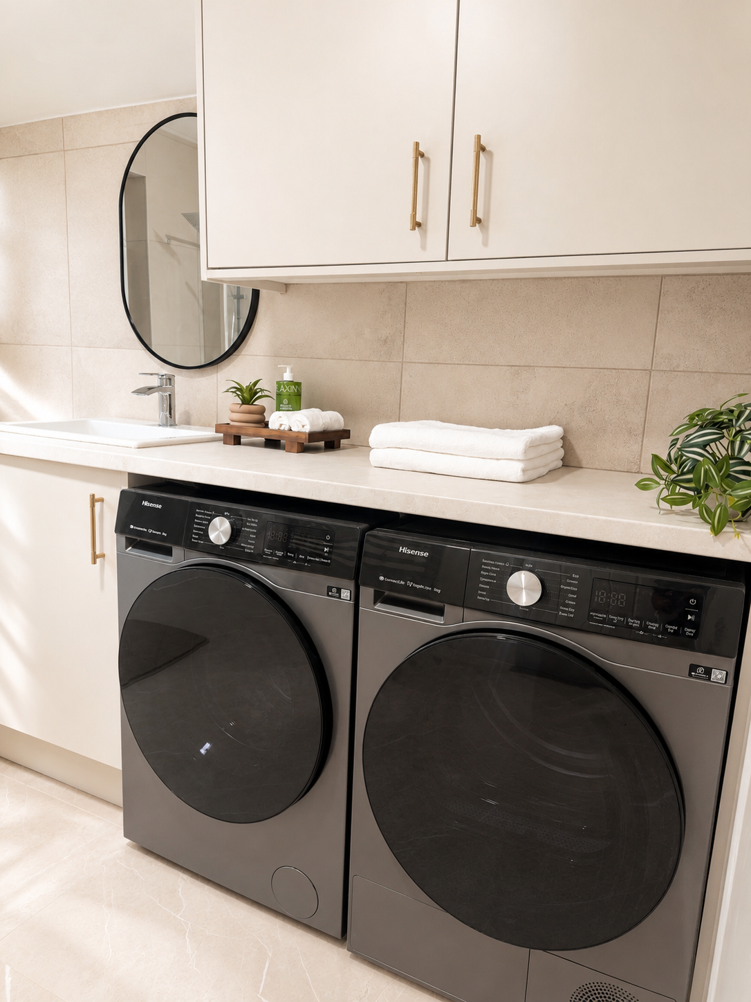 Bathroom and utility area with washer, dryer and fresh towels at the Wellingborough Luxury Staycation